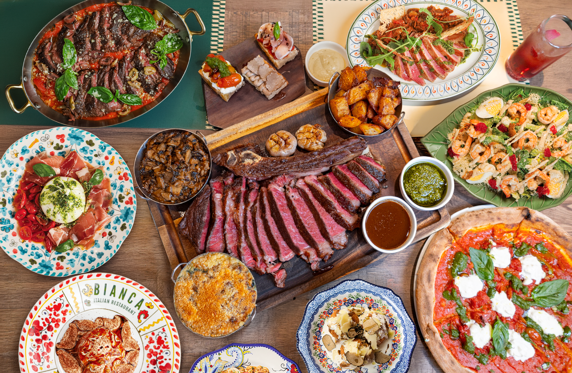 Italian feast at Bianca with sliced steak, pizza, burrata, salads and sides for sharing